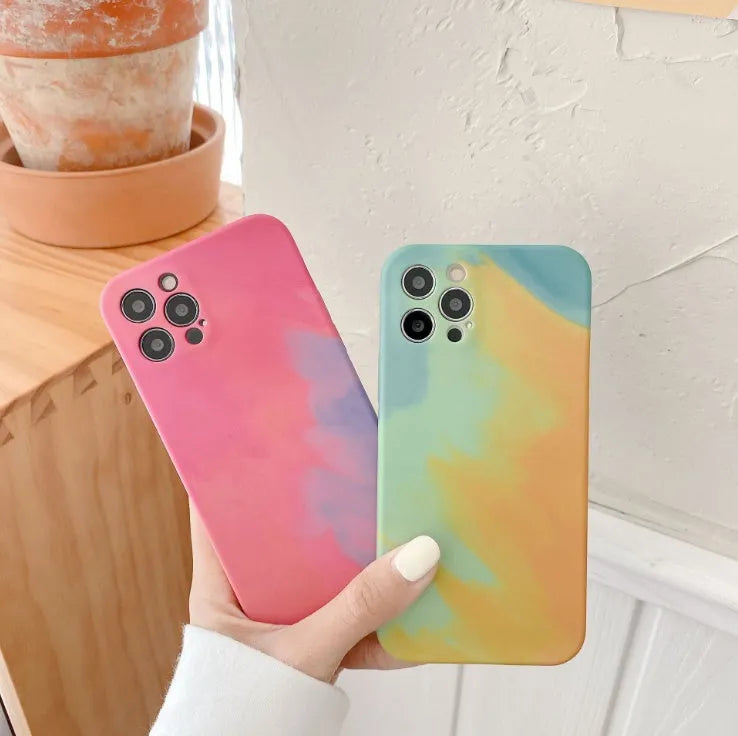 Soft silicone iPhone case with a blue and purple gradient geometric abstract pattern, shown on a phone.