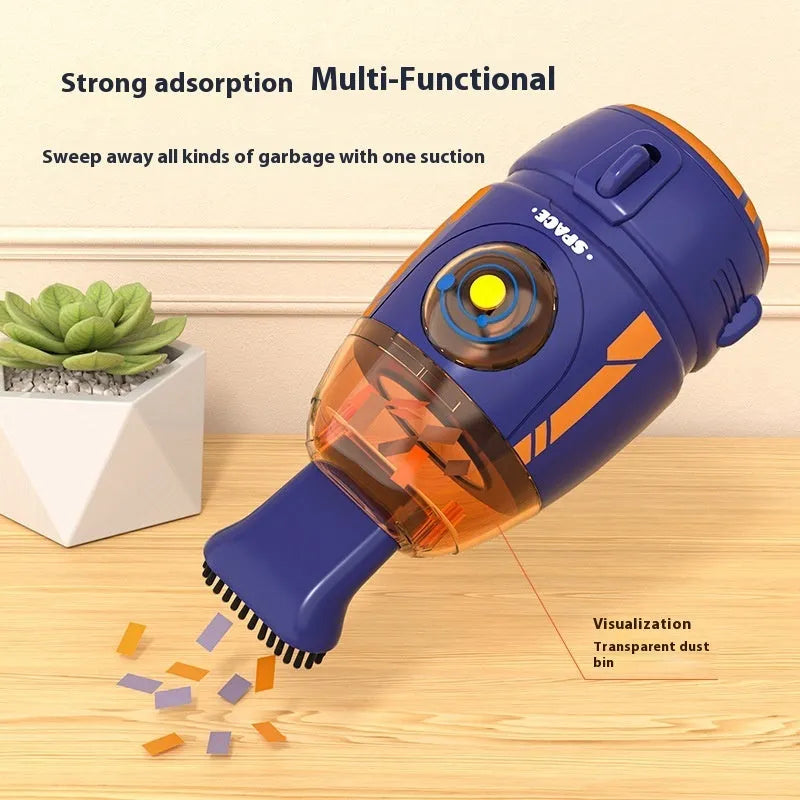 USB handheld desktop vacuum cleaner in blue rocket design on a wooden desk.