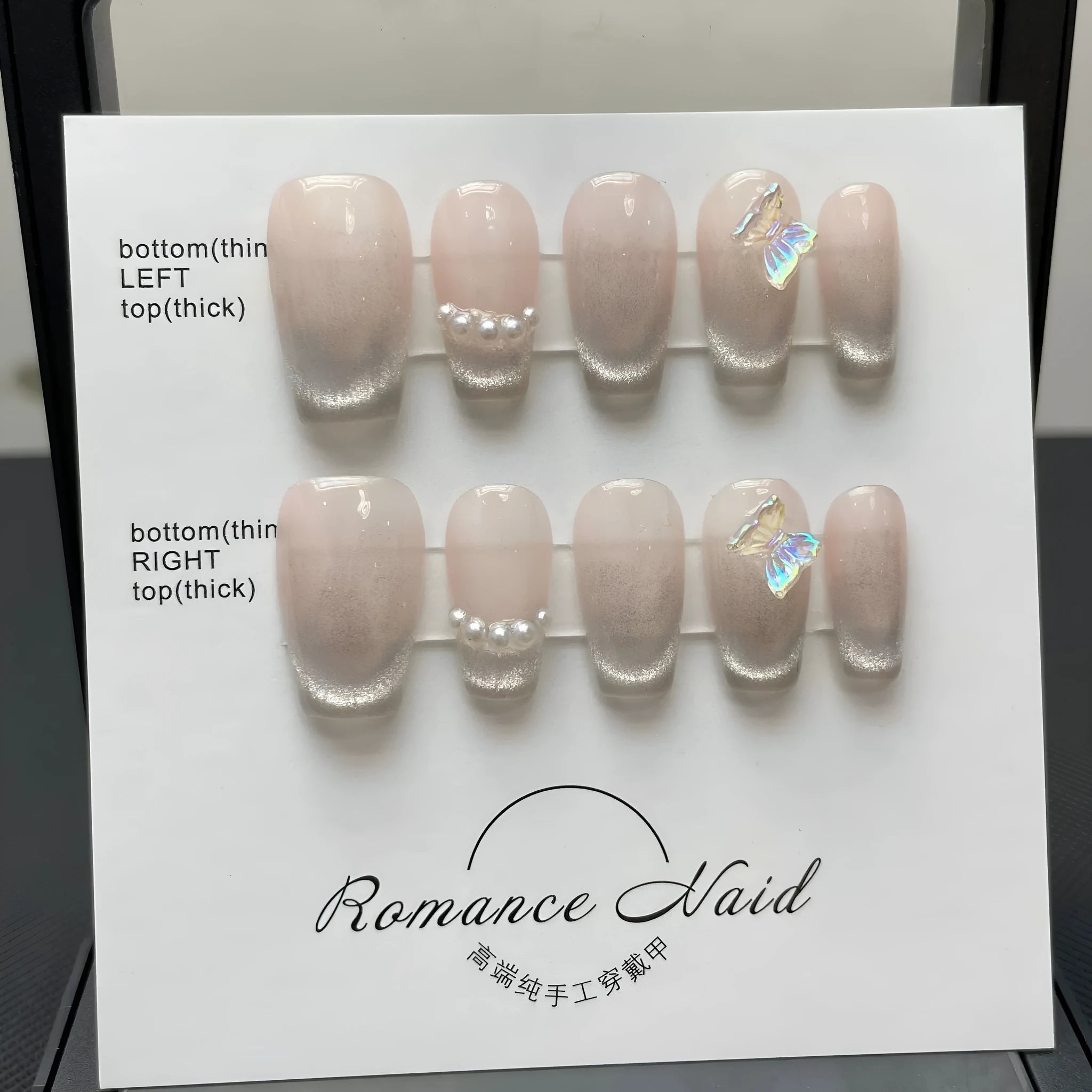 Women's false nails set with blush armour design in pink tones, short ladder tip shape