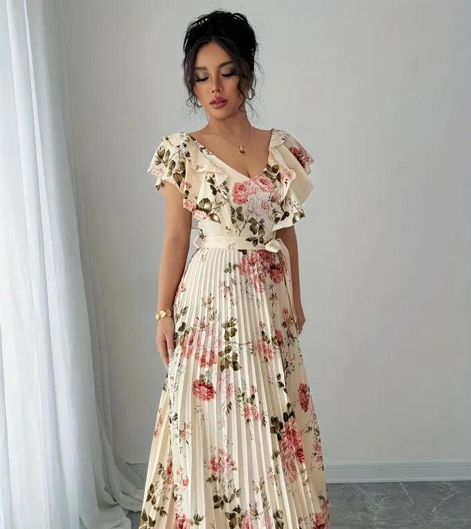 Apricot floral print women's dress with v-neck, ruffled short sleeves, and a high-waisted pleated swing skirt.