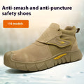 Brown leather men's work safety shoe with rubber sole, shown on a grey background.