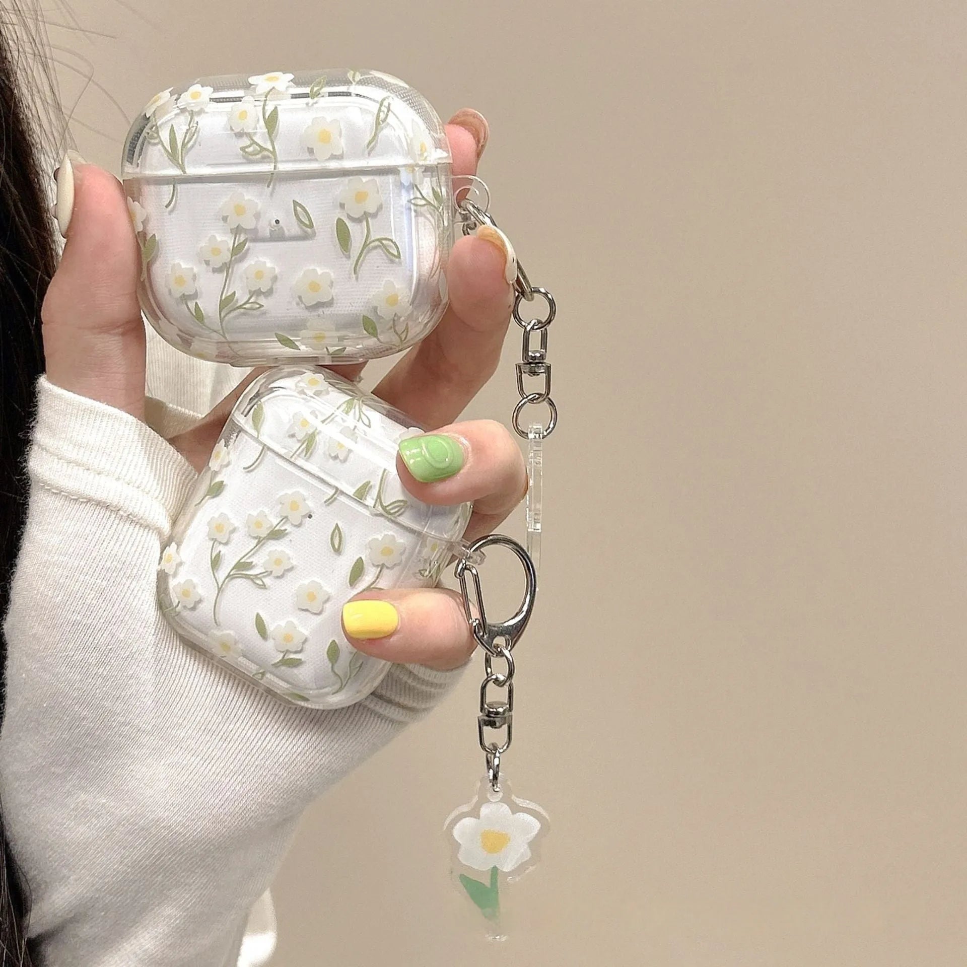 Transparent white floral TPU protective case for Apple AirPods showing decorative pattern