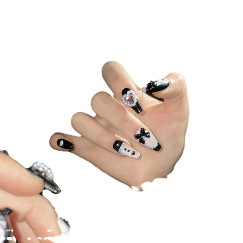 Hand-painted black pink heart design plastic nail armour set in four sizes