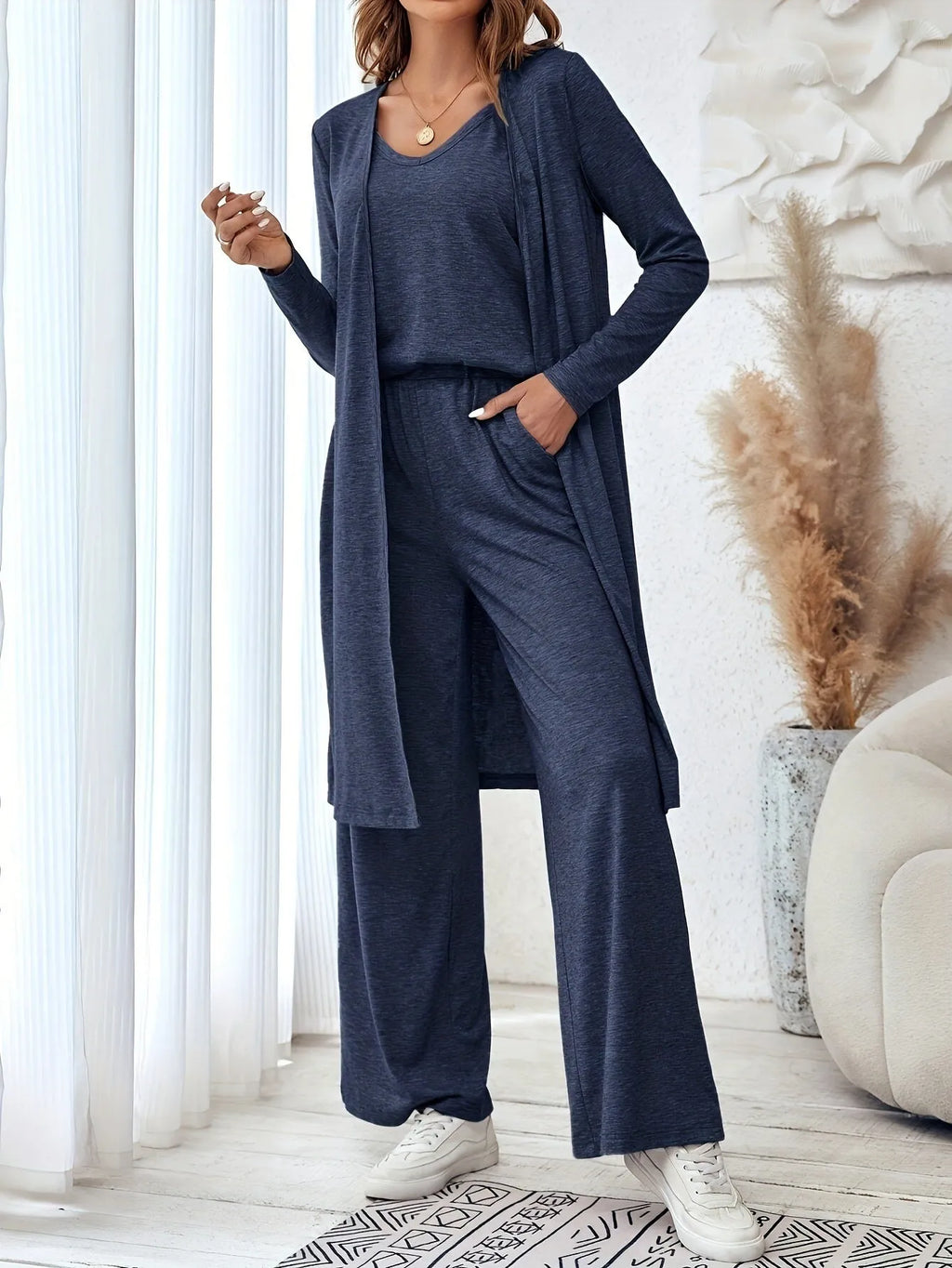 Blue womens casual co-ord set featuring a long sleeve top and matching trousers with detachable braces.