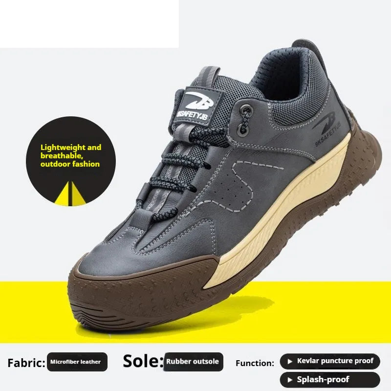 Flyknit leather work safety shoe with rubber sole in black, shown on a grey background