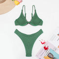 Green women's bikini set with ruffle trim, showing top and split briefs made from quick-dry polyester fabric.