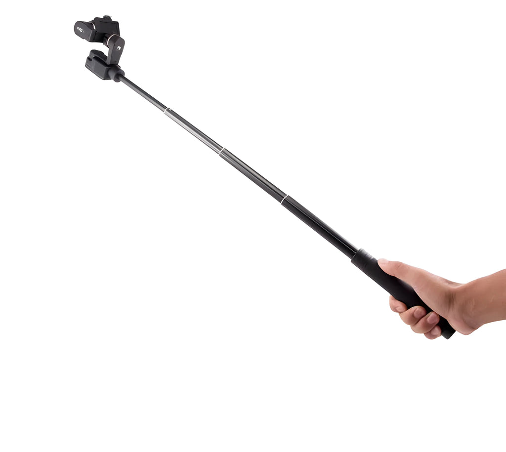 Black retractable aluminium selfie stick extended with a phone attached, showing its handheld stabiliser grip.