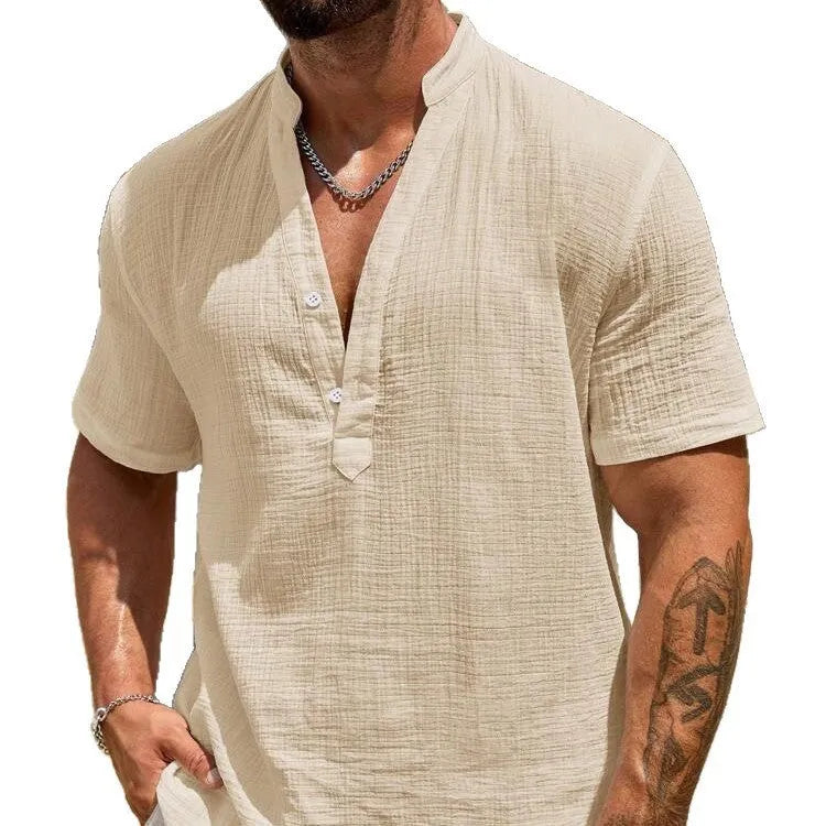 Man wearing a light blue stand collar short-sleeved casual shirt for summer.