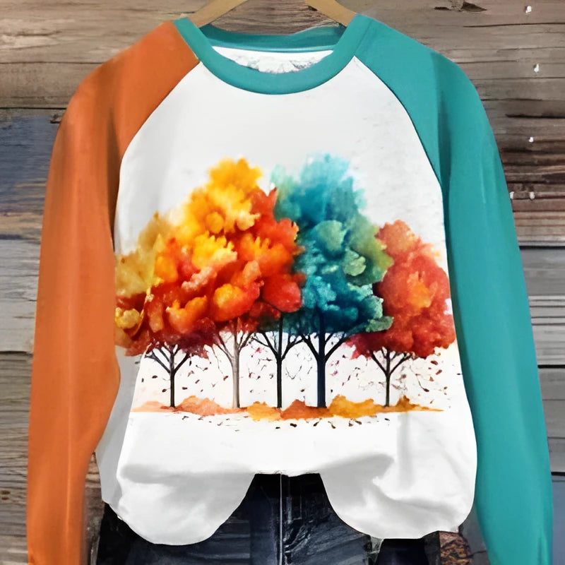 Green women's hoodie showing a large 3D cartoon character print on the front.