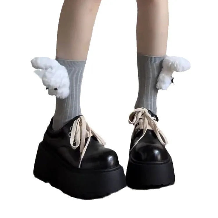 Matte black women's lace-up shoes with a high English muffin heel and thick rubber sole.