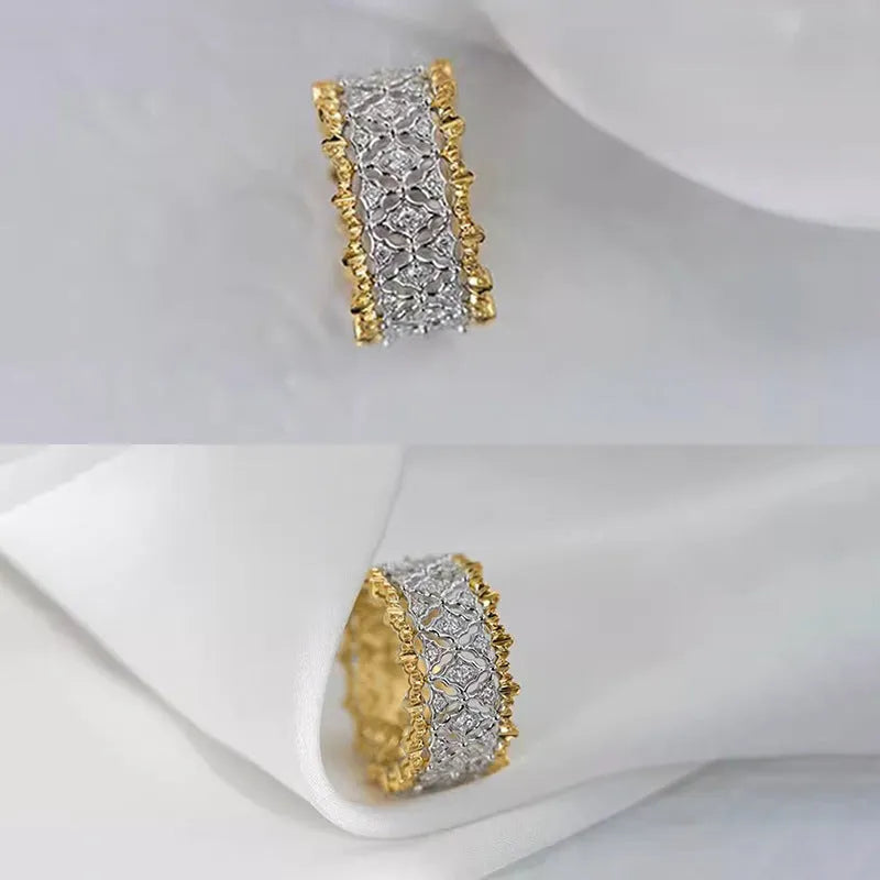 A geometric two-tone gold ring with a round zircon detail on a copper band.