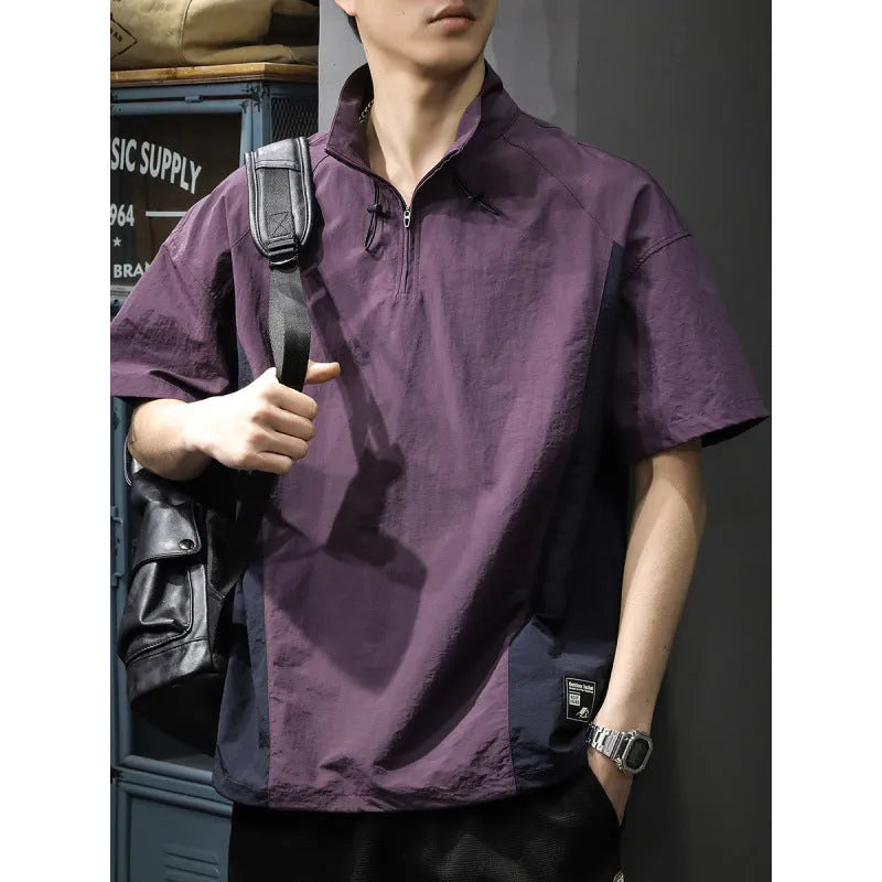 Man modelling a brown half-zip stand collar casual shirt with short sleeves.