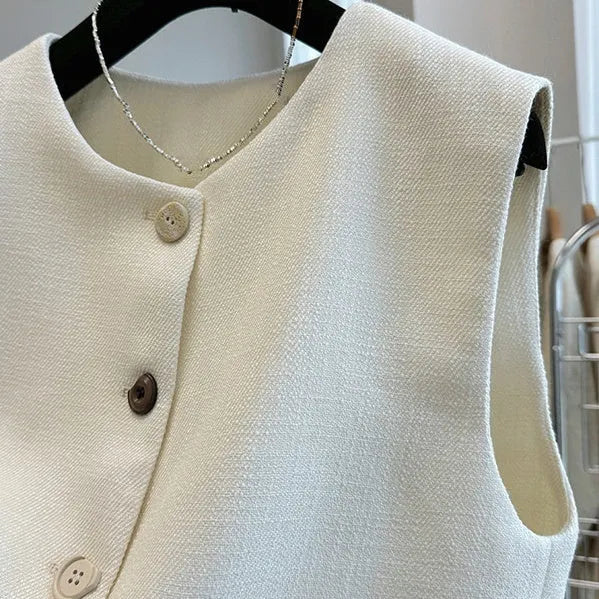 Women's sleeveless polyester bandage vest dress with round neck in milky white.