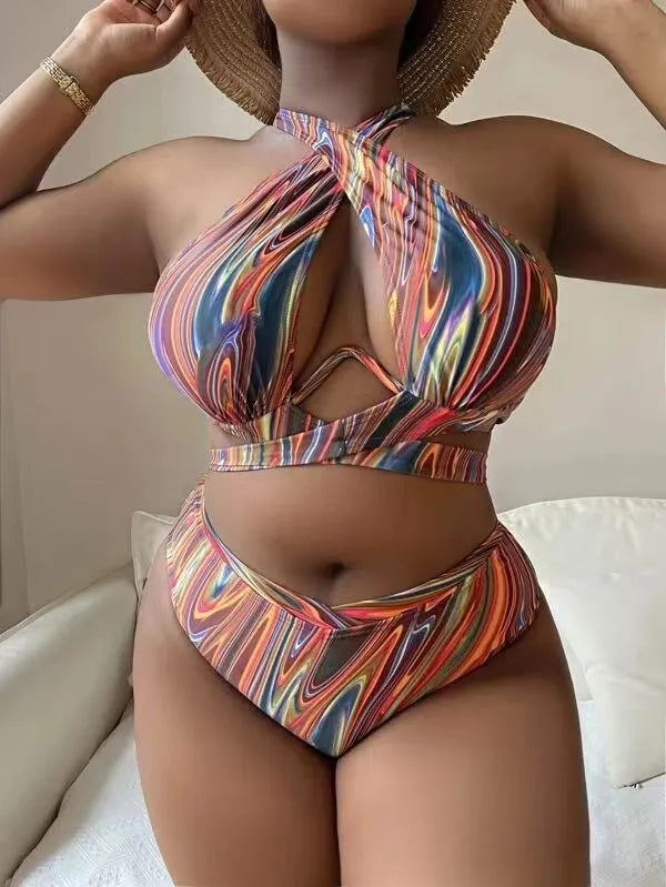 Women's floral high-waist bikini swimsuit top and pants in plus sizes.