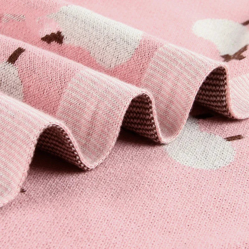100x80cm grey and pink baby sheepskin blanket made from 100% cotton fabric laid flat.