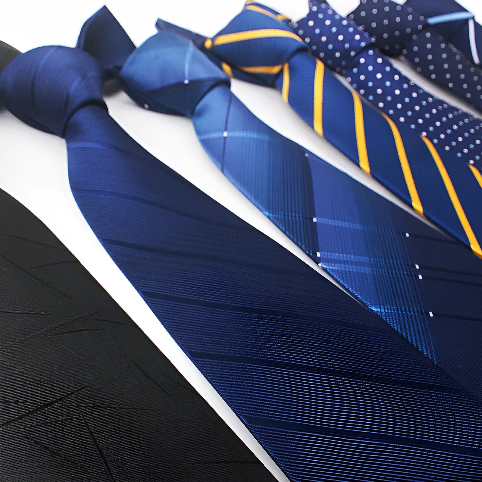 Men's red, black and blue striped polyester jacquard tie with a traditional arrow shape.