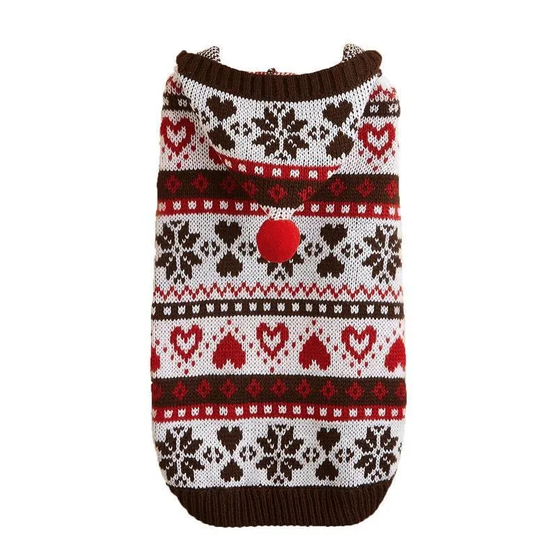 Small pink dog sweater with striped camouflage and snowflake patterns on a mannequin.