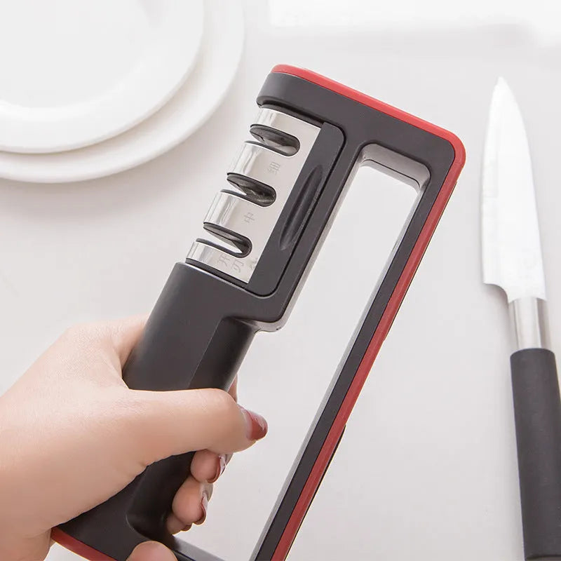Black and red professional three-stage knife sharpener with non-skid rubber feet.