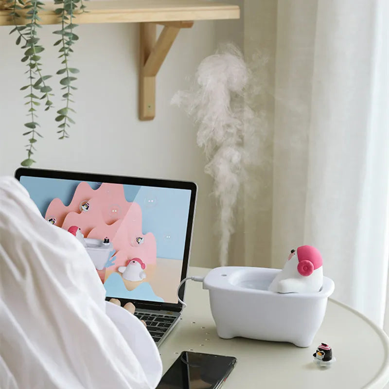 White USB desktop air humidifier with 550ml transparent water tank showing nano mist output