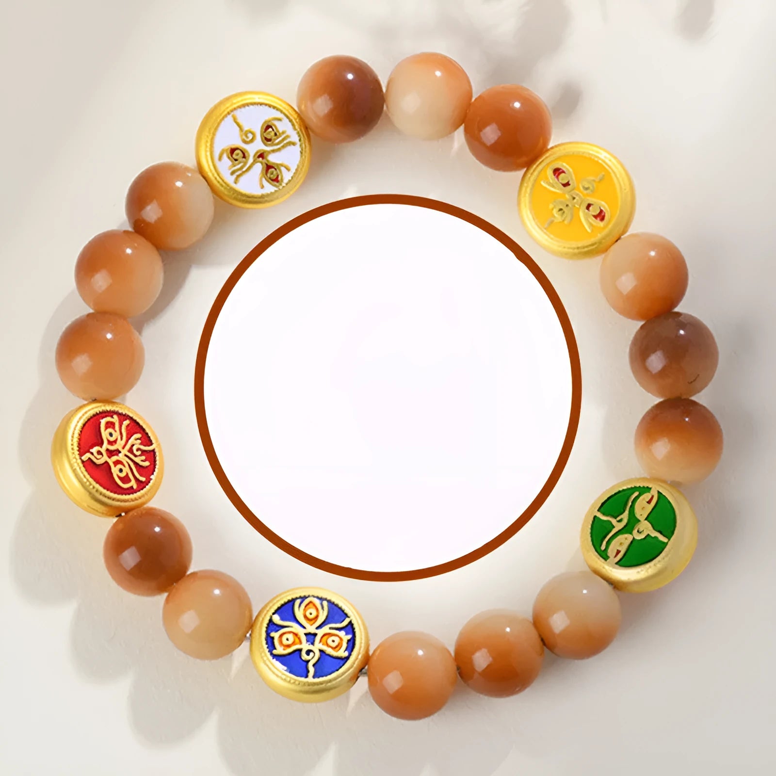 Yellow Bodhi seed bracelet with five directions geometry pattern on wooden surface