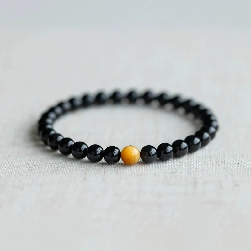 Black obsidian geometric bead bracelet in Korean style, showing size options.