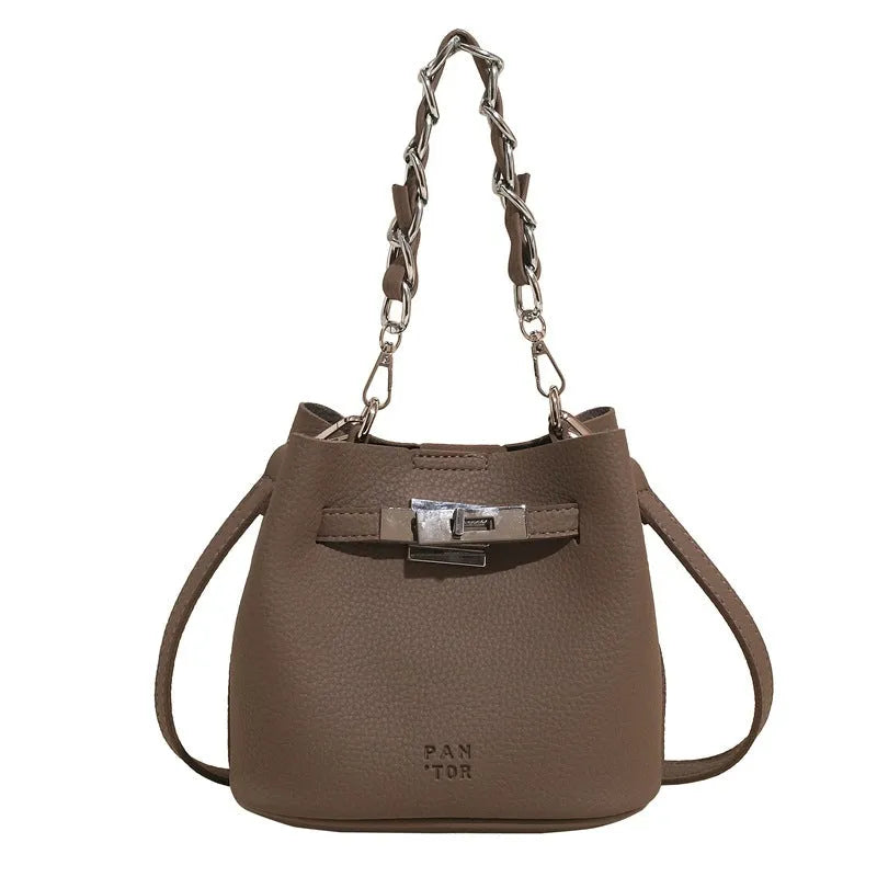 Soft PU leather retro bucket shoulder bag in black showing internal organiser pockets.