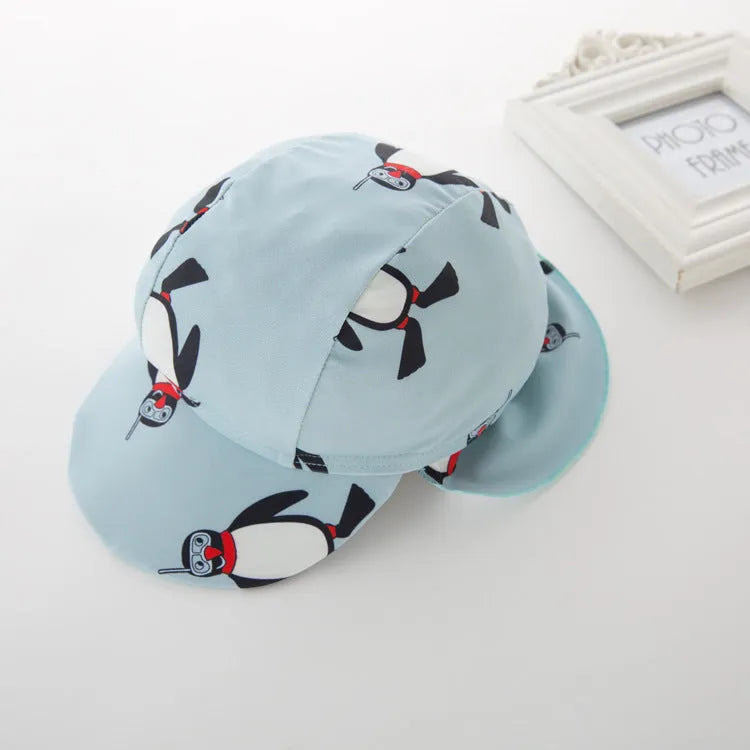 Boys' penguin print long sleeve swimsuit set with matching swimming cap for sun protection