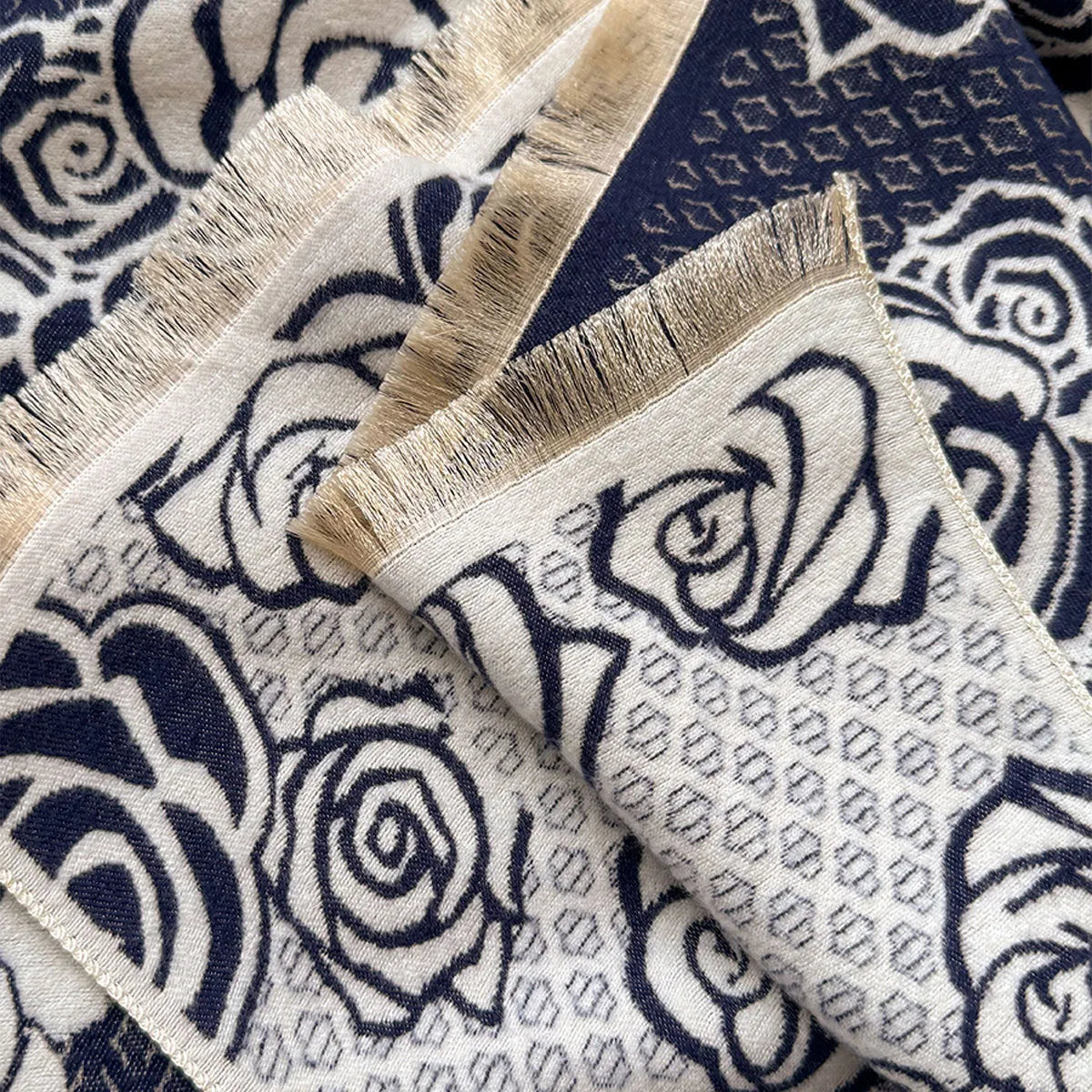 Long grey cashmere-like winter scarf with tassels, shown draped to display its length and texture.