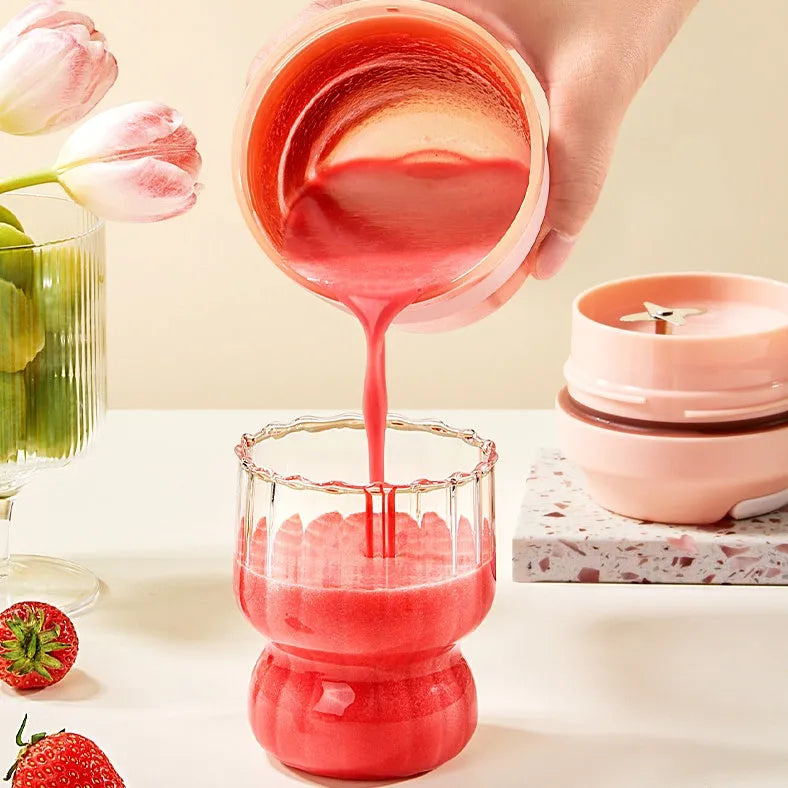 Portable 400ml blender juicer cup with four stainless steel blades in purple, green, or orange colours