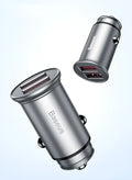 Black aluminium alloy dual USB smart car charger plugged into a 12V car socket.