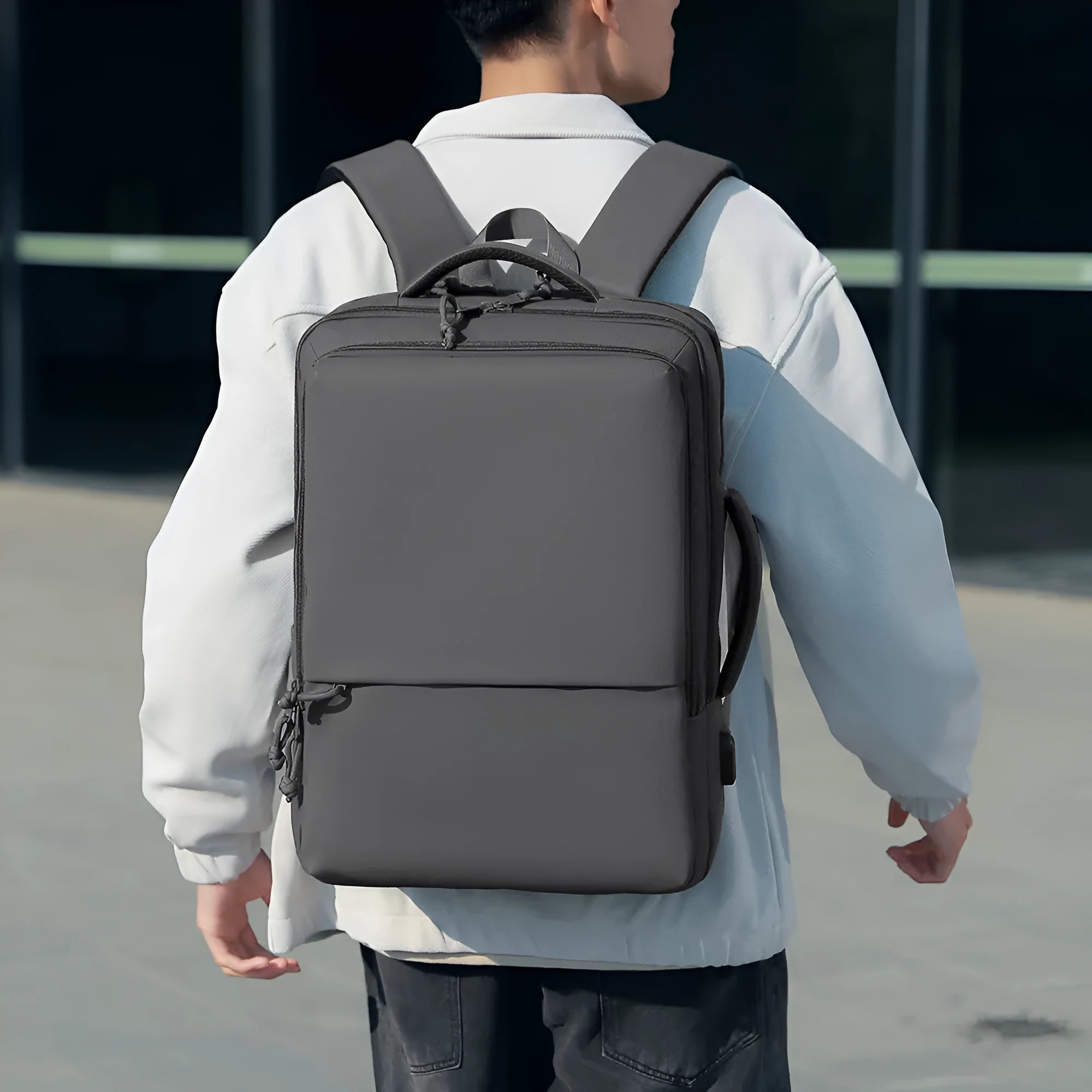 Waterproof Oxford cloth backpack in business style with air pillow belt system, shown in multiple colour options