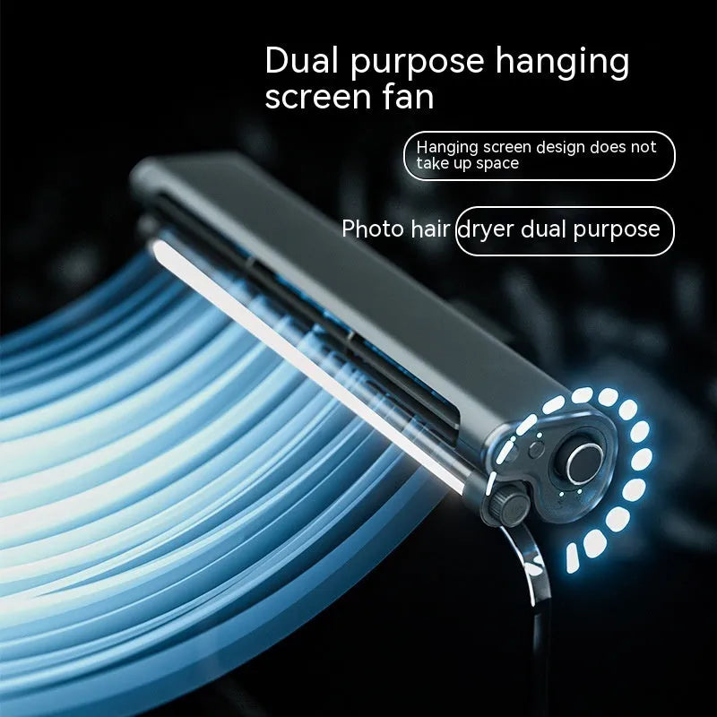 Black bladeless USB fan with clip attached to a laptop screen, showing integrated LED light.