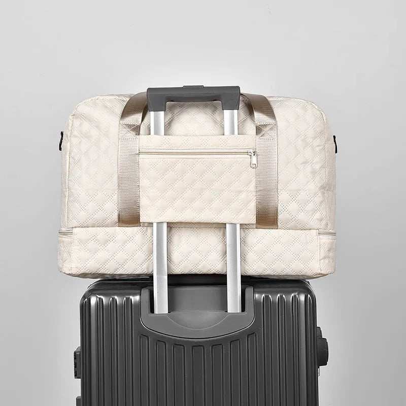Large Oxford cloth travel holdall in a solid colour, shown with a capacity of 36-55 litres for buggies and luggage.