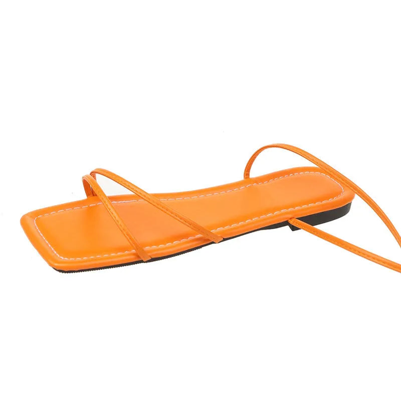 Women's flat sandals with ankle ring bandage detail and front lace-up closure in three colour options