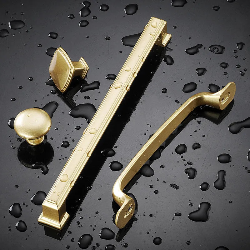 Modern gold T-shaped single hole cabinet handle made from aluminium alloy, showing its profile.