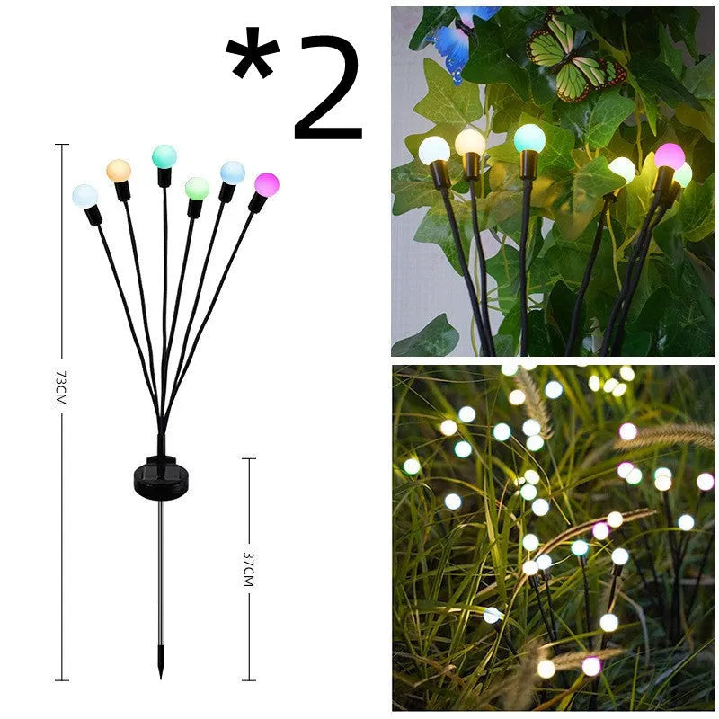 Solar-powered LED garden light with multiple heads on stainless steel ground spikes