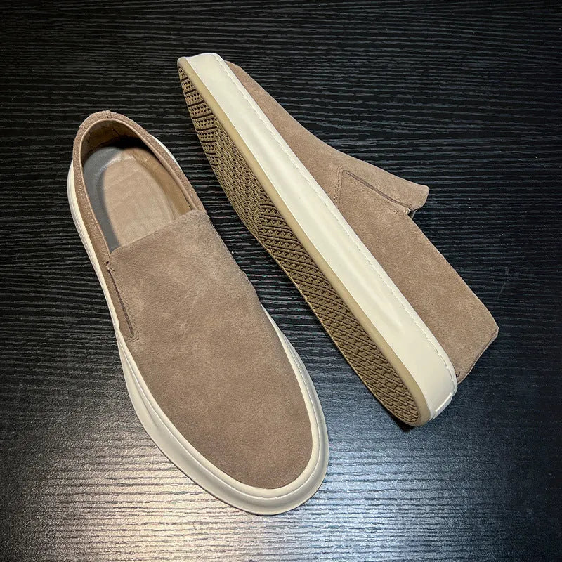 Men's grey casual shoes with round toe design and sewing line detailing showing rubber soles