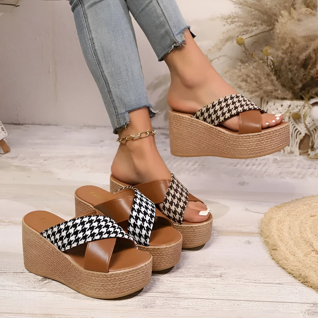 Casual brown and black plaid wedge sandals with a non-slip rubber sole.