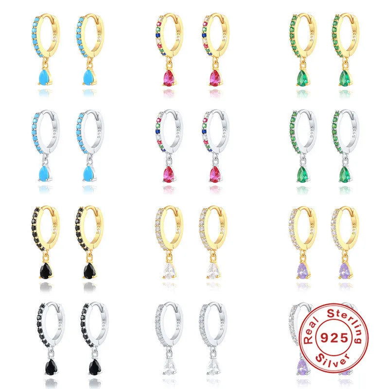 Geometric water drop sterling silver earring with a crystal stone in a gold tone setting.