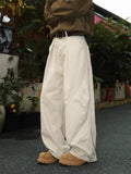 Men's straight leg pleated trousers with micro elastic waist in black, brown and apricot stripe patterns