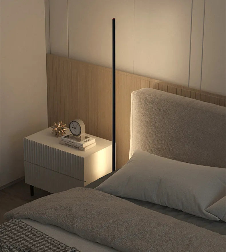 Tall, slim aluminium alloy vertical floor lamp with a simple design and LED light.