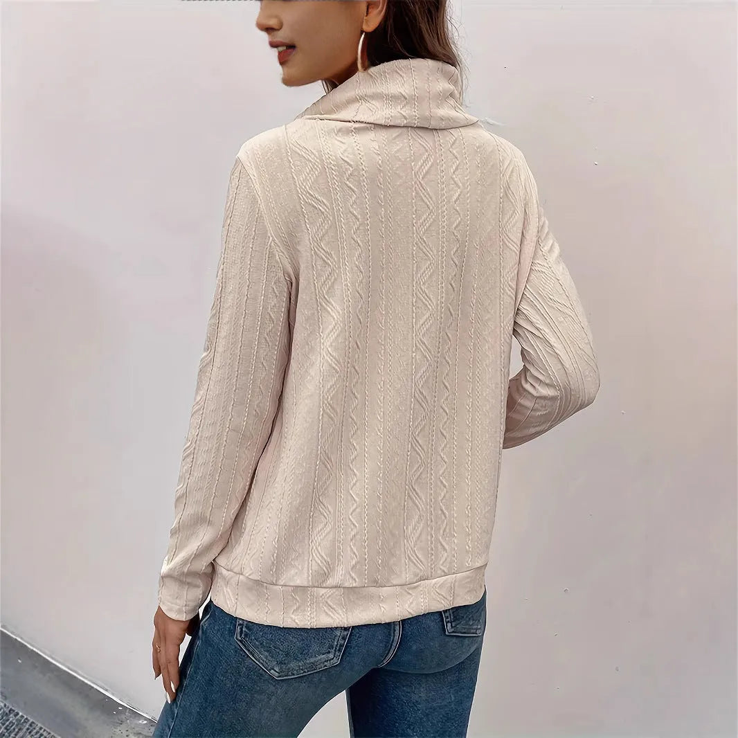 Apricot coloured long sleeve hooded pullover sweater on a hanger, showing the drawstring and solid colour.