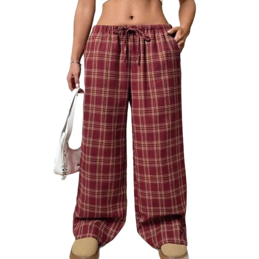 Blue plaid women's casual trousers with drawstring waist and pockets on a hanger.