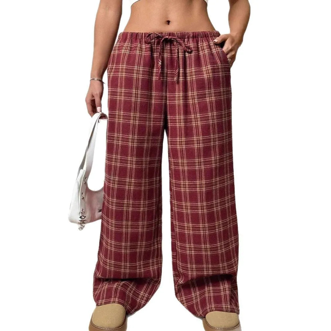 Blue plaid women's casual trousers with drawstring waist and pockets on a hanger.