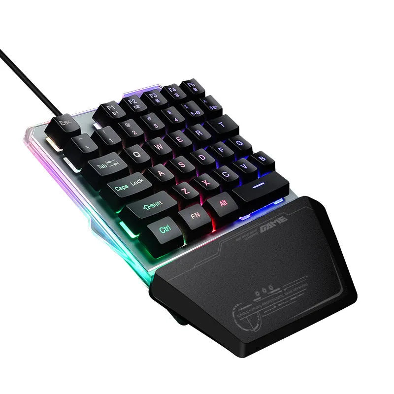 G40 Flow black one-handed robotic keyboard with RGB backlight on a desk.