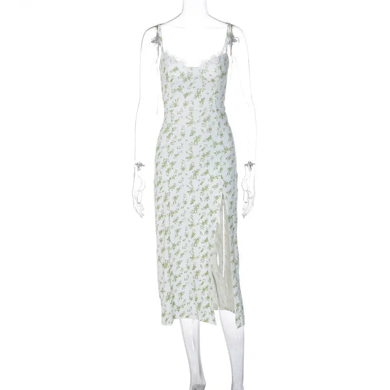 Women's long lace floral print dress with front slit and suspender straps in blue.