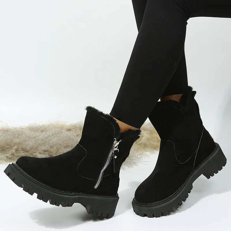 Women's black high-top faux suede snow boots with side zip and thick plush lining on a rubber sole.