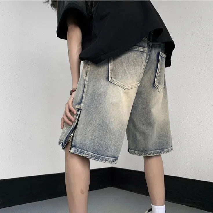 Blue retro tattered denim shorts with a wide leg loose fit on a person