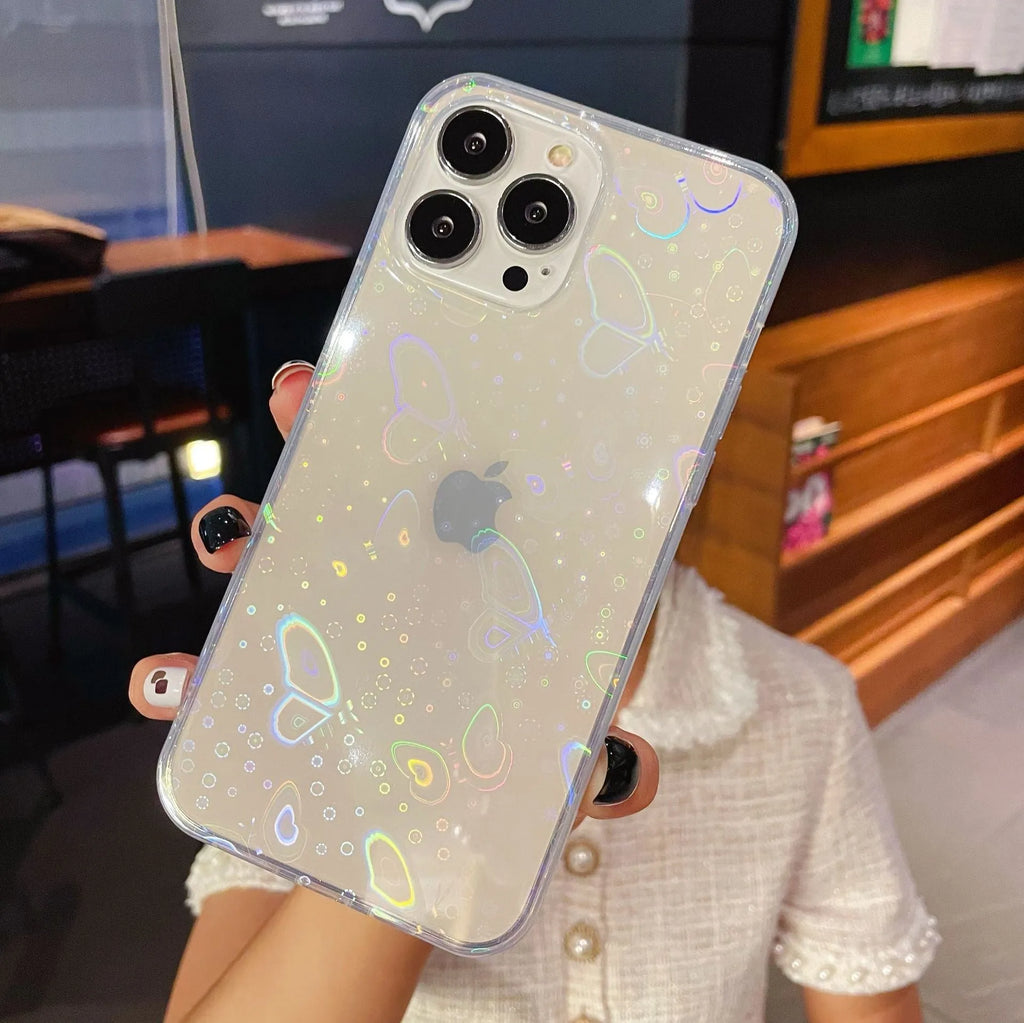 Transparent silicone iPhone case with a laser-etched love heart design on the back.