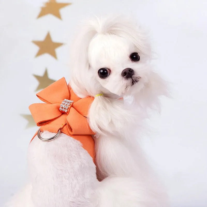 A pink microfiber puppy chest strap with a bowknot, shown alongside blue and orange options.